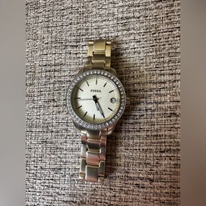 Used gold Fossil watch.